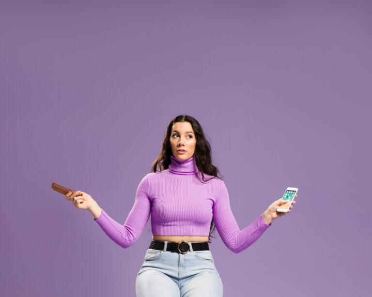 girl with phone on purple background