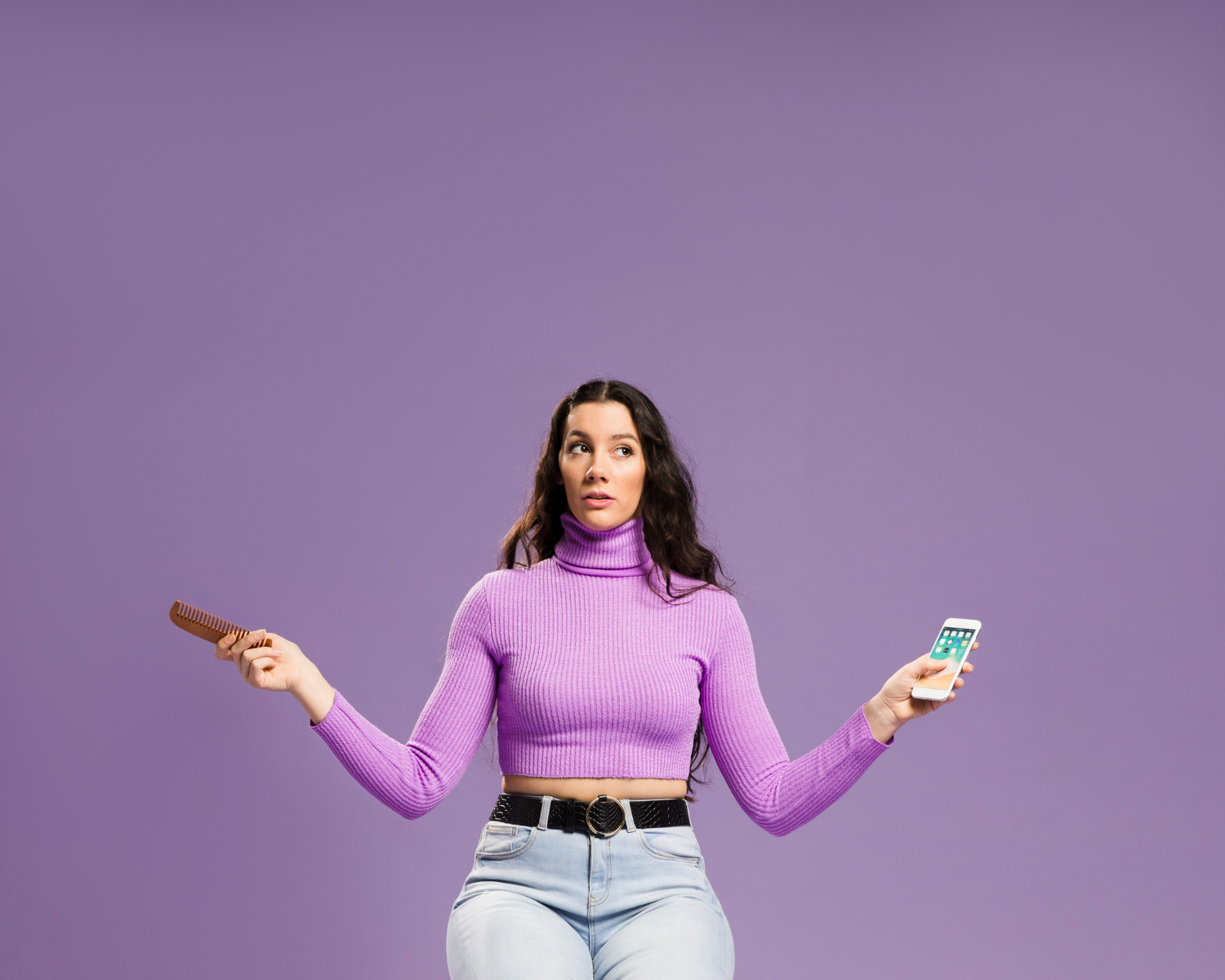 girl with phone on purple background