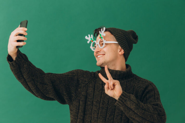 guy with glasses takes a selfie