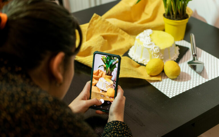girl takes a photo on a smartphone