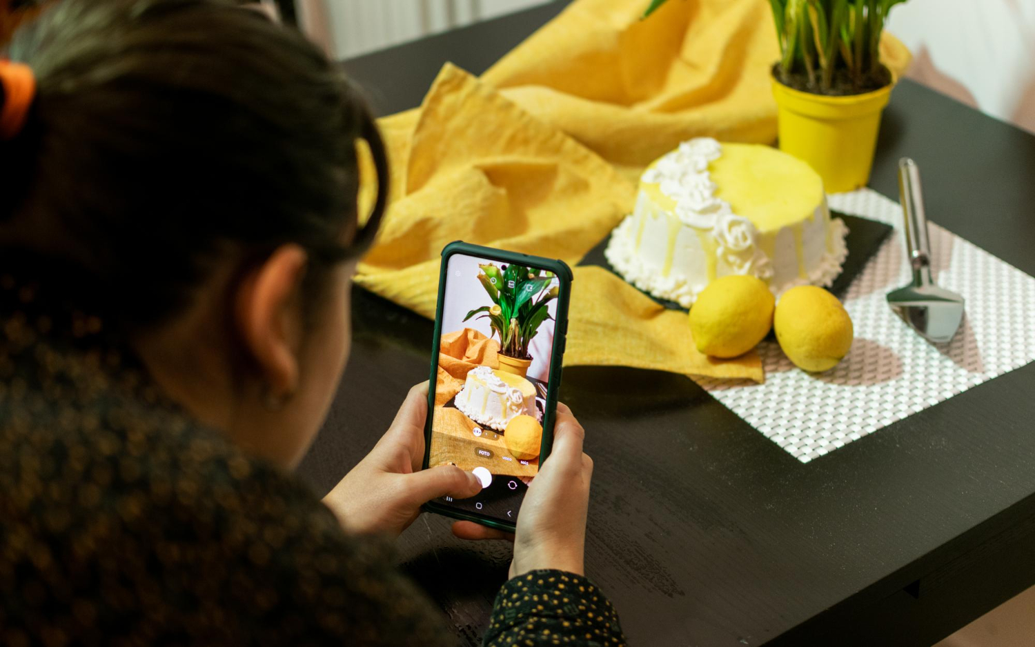 girl takes a photo on a smartphone